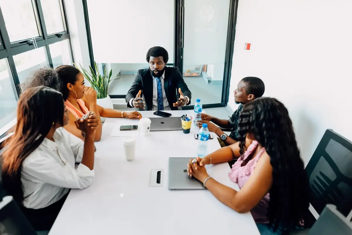 African professionals discussing a multilingual business project, illustrating Professional Translation Company in Uganda — Vanguard Linguistics African professionals discussing a multilingual business project, illustrating Professional Translation Company in Uganda — Vanguard Linguistics