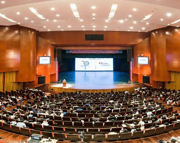Large auditorium prepared for a professional conference, illustrating Professional Translation, Interpretation and Localization Services in Uganda Large auditorium prepared for a professional conference, illustrating Professional Translation, Interpretation and Localization Services in Uganda