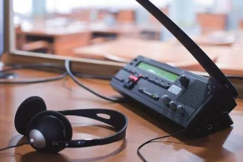 Clear recordings and an agreed transcript or subtitle specification reduce avoidable uncertainty. Professional headset and audio console used for media localization